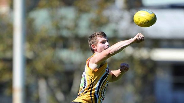 Punching above his weight: Richmond defender Dylan Grimes has a tough initiation ahead.