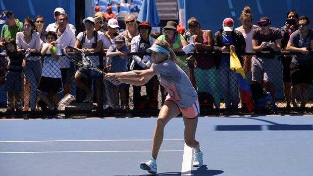 A crowd watches Canadian Eugenie Bouchard as she trains on Wednesday.
