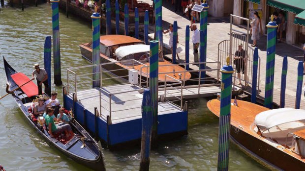 People look at the site of a boat accident in Venice where a German tourist was killed.
