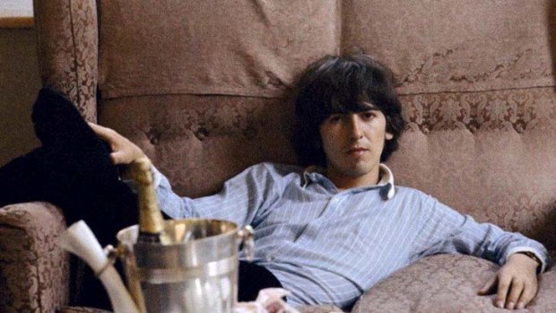 Material pursuits ... George Harrison finds time to put his feet up.