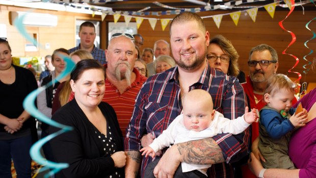 Kylie and James Wiggins celebrate the first birthday of their son, Dolton, with family and friends. 