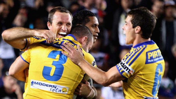 Luke Burt celebrates one of his two tries. The veteran tallied 16 of the Eels' 24 points.