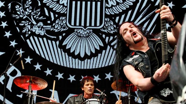 Rocking: Tommy Bolan on guitar and Richie Ramone on drums at ANZ Stadium on Saturday.