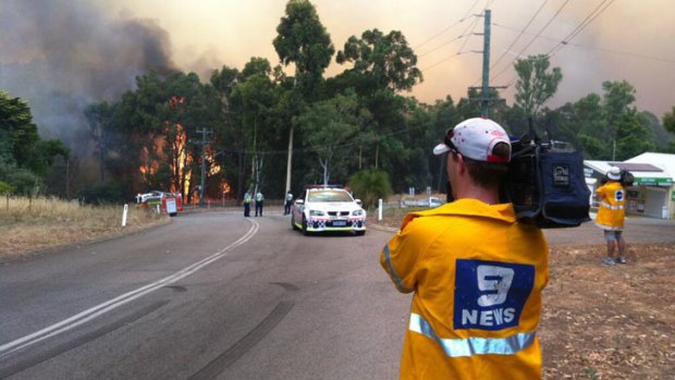 Firefighters battle the bushfires on Sunday.