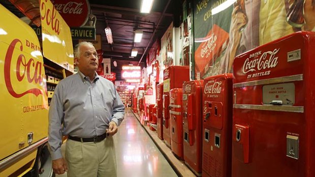 Larry Schmidt looks over some of the dozens of vending machines in his Coca-Cola museum in Elizabethtown, Ky.
