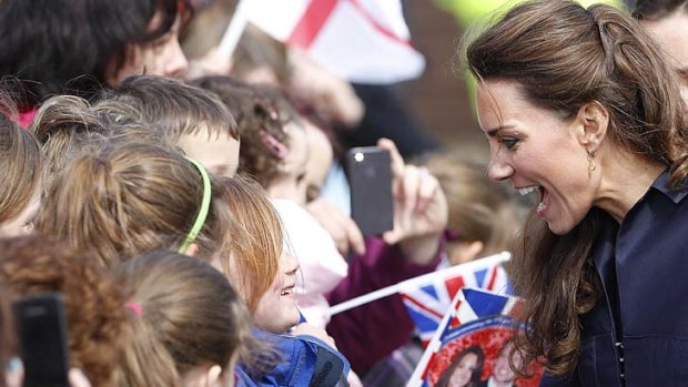 Nice to meet you .... Kate Middleton talks to some children.