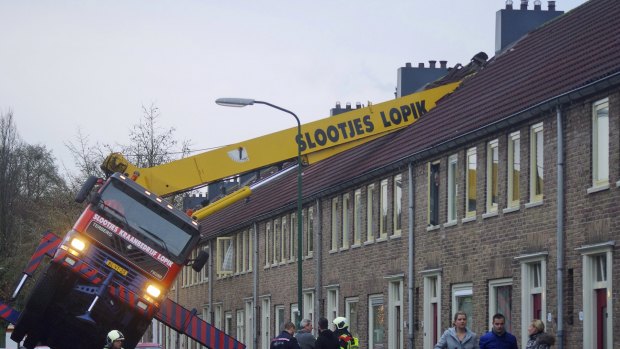 A crane crashed into the roof of a house when a man's wedding proposal went wrong.