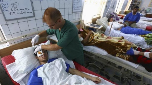 Growing casualty list ... A man, who was injured during a suicide bomber attack in Mwafaqiya village at Mosul, receives treatment in a hospital in Arbil, the capital of the autonomous Kurdistan region.