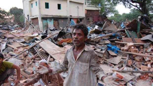 Homeless and angry: Slum resident Basant Paswan  beside the ruins of  his house in Delhi's Netaji Nagar slum.