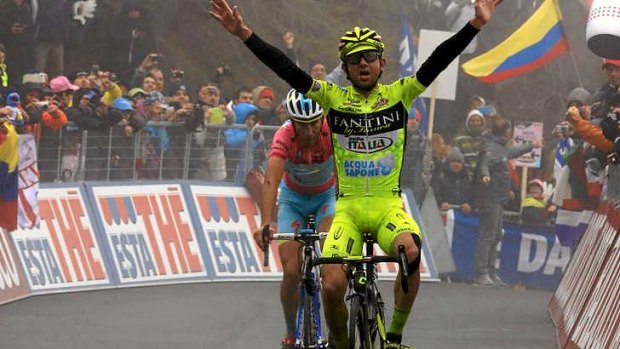 Mauro Santambrogio of ITaly celebrates winning stage 14 with Nibali just behind.