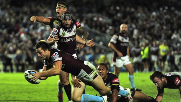 Centre of controversy: Kieran Foran goes over for Manly.