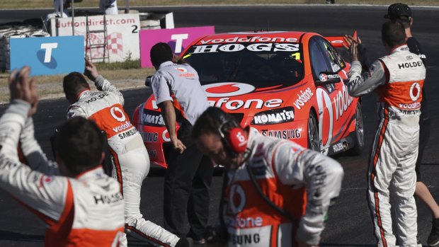 Over the line &#8230; Jamie Whincup shares victory with his crew at Winton on Saturday.