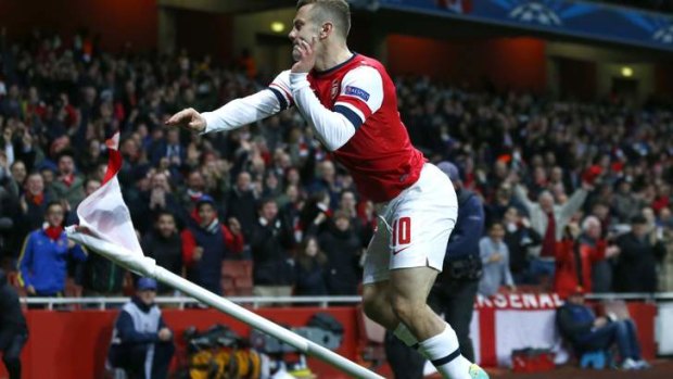 Jack Wilshere celebrates after scoring the opener against Olympique Marseille.