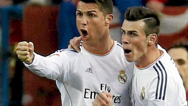 Stars align: Real Madrid's Cristiano Ronaldo is congratulated by teammate Gareth Bale after scoring a goal against Atletico Madrid.