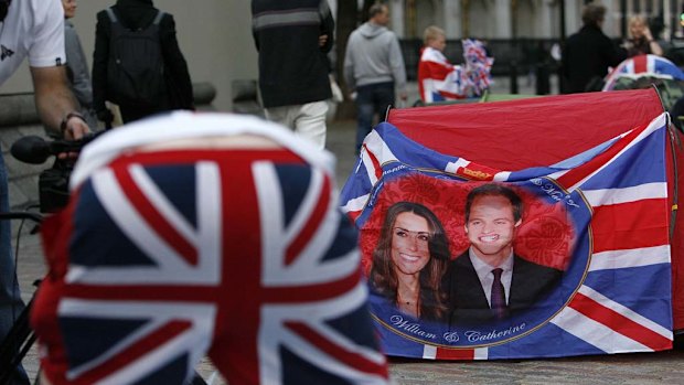 Revelers gather outside Westminster Abbey in London on  Tuesday.