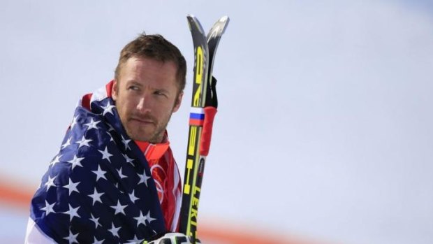 No talk of retirement ... bronze medallist US skier Bode Miller, 36, arrives on the podium during the Men's Alpine Skiing Super-G Flower Ceremony.