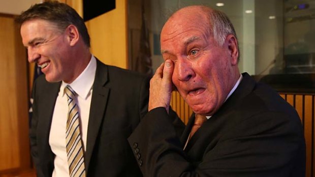 Calling it quits: an emotional Tony Windsor stands with Rob Oakeshott after announcing he will not recontest the next election.