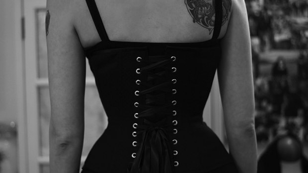 Tara Moss wearing a corset she  made herself after doing a specialised course. The asymmetry in her back is evident. 