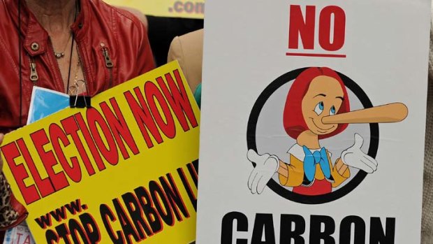 Anti-carbon tax protest placards ... Tony Sheldon argues the Gillard government is too preoccupied.