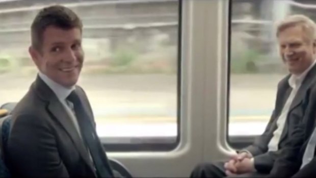 Premier Mike Baird rides a train in the Daily Telegraph advertisement.