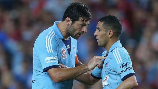 Tense times: SYdney FC midfielder Ali Abbas (right) being spoken to by teammate Sasa Ognenovski during Saturday night's A-League match.