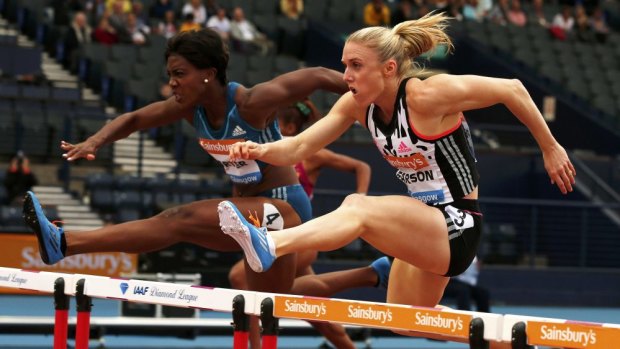 Sally Pearson (R) of Australia and Tiffany Porter of Great Britain compete in the women's 100m hurdles at Hampden Park.