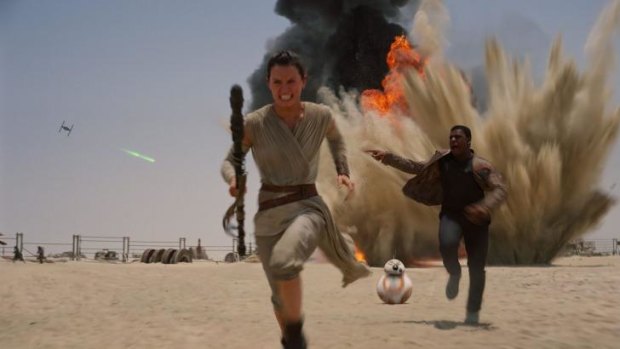 Daisey Ridley as Rey, left, and John Boyega as Finn in <i>Star Wars: The Force Awakens</i>.