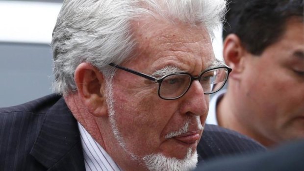 Rolf Harris arrives at Westminster Magistrates Court, to face sex offence charges, in London in September 2013.