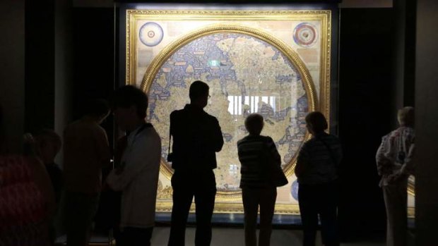 Visitors take a look at the map of the world 1448-1453 by Fra Mauro.