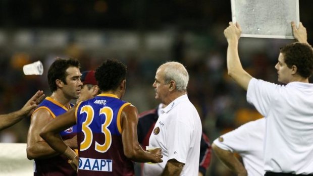 Brad Scott, left, in his last game, with coach Leigh Matthews, right.