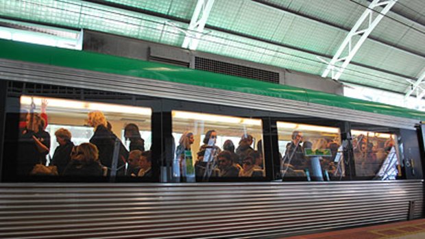 A packed train pulls into Leederville station.