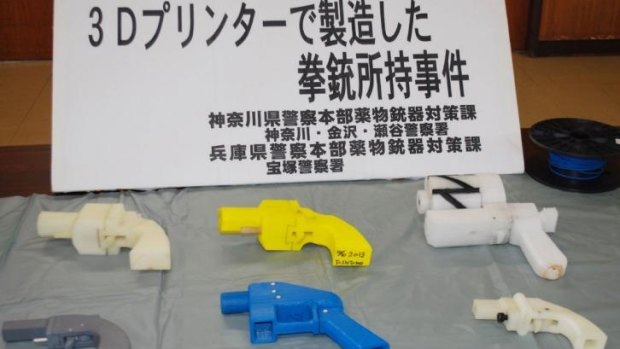 Seized plastic guns produced by a 3D printer are displayed at a police station in Yokohama.