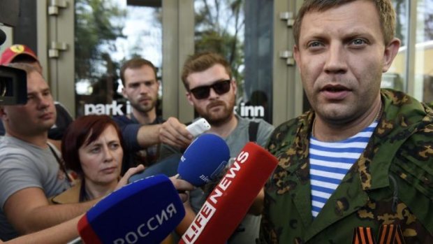 Alexander Zakharchenko, prime minister of the self-proclaimed Donetsk People Republic, talks with the media as he goes out from a meeting with the OSCE supervisors on Monday in Donetsk, eastern Ukraine.