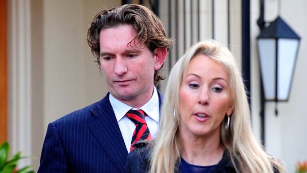 Big day: James Hird and wife Tania leave their Toorak home on Tuesday morning, heading for AFL House.