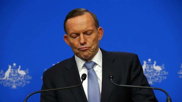 Prime Minister Tony Abbott addresses the media on Malaysia Airlines Flight MH17 during a press conference at Parliament House in Canberra on Tuesday.