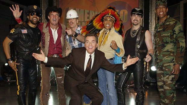 Dick Clark, centre, with members of The Village People, in 2002.