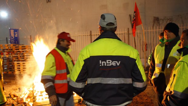 Bosses taken hostage ... workers protest outside an Anheuser-Busch InBev plant in Leuven, Belgium.