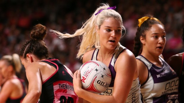 Gretel Tippett of the Firebirds wins the ball during the round six Super Netball match against the Thunderbirds.