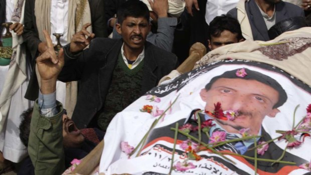 The funeral takes place in Sana'a, Yemen, of one of 52  anti-government protesters shot dead by rooftop snipers on Friday.