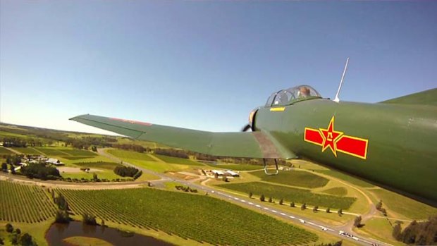 Flying high ... a Nanchang CJ-6A fighter aeroplane near Cessnock.