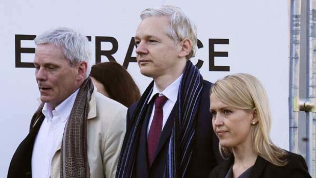 WikiLeaks founder Julian Assange (centre) arrives at Belmarsh Magistrates' Court in south-east London with WikiLeaks spokesman Kristinn Hrafnsson (left) and legal team member Jennifer Robinson.