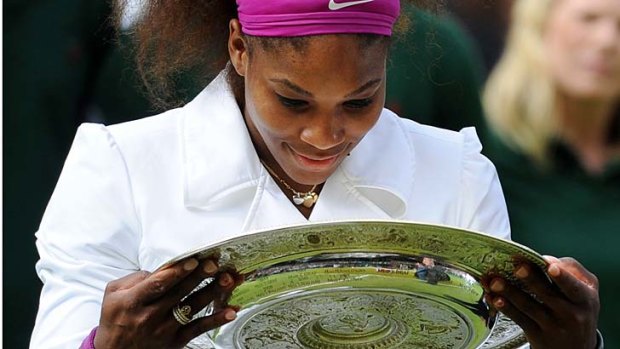 Picture perfect: Serena Williams with her fifth Wimbledon singles trophy.