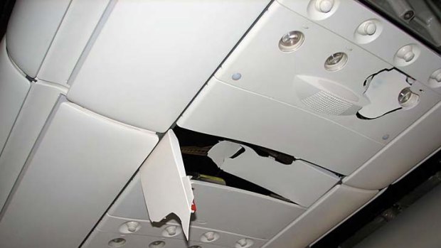 Damage to the fittings above passenger seats caused by the plunge of the Qantas flight.