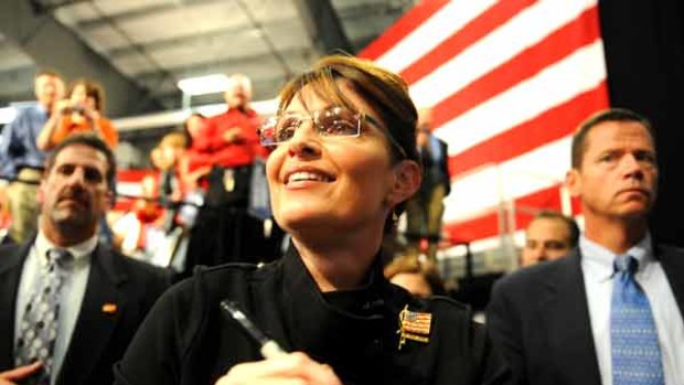 Republican vice-presidential candidate Sarah Palin greets supporters at a welcome home rally in Alaska.