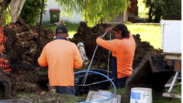 Contractors in Kiama install the fibre optic cables for the National Broadband Network earlier this year.