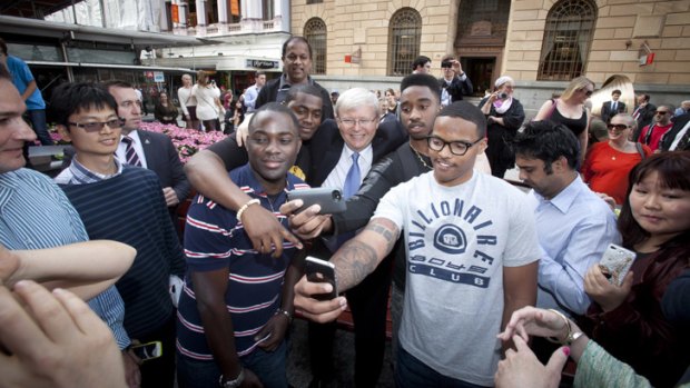 Prime Minister Kevin Rudd soaks up the love during his Queen Street Mall walkabout on Friday.