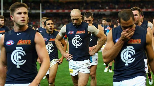 The Blues look dejected after losing to the Bombers.