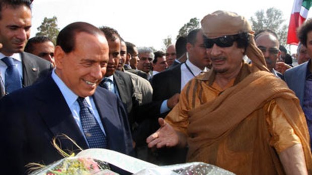 Mr Berlusconi and Colonel Gaddafi mark the start of the new highway.