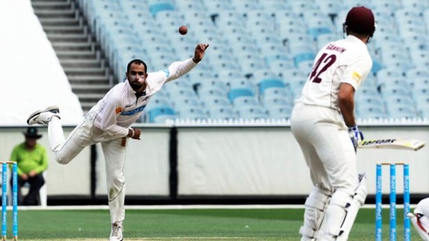Fawad Ahmed bowls to Cameron Gannon.
