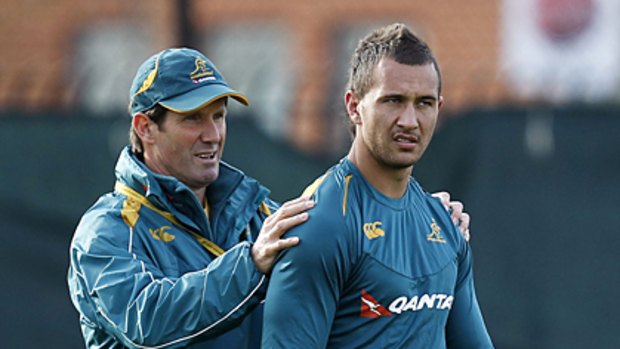 Arrested ... Quade Cooper with Australian coach Robbie Deans in London last month.